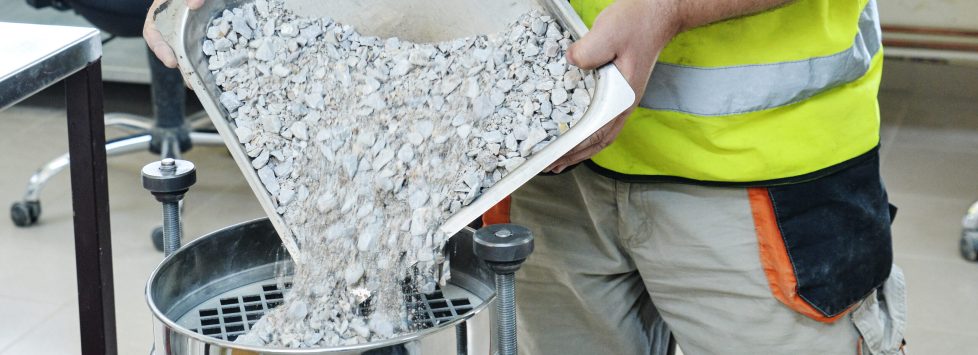 On,Site,Road,Testing,Laboratory.,Placing,Sample,Of,Gravel,Into